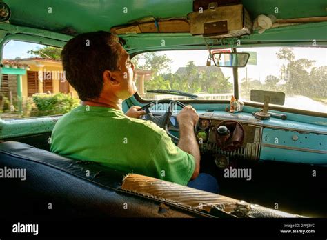 Taxi driver and interior Stock Photo - Alamy