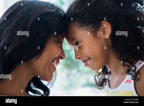 Mother And Daughter Touching Foreheads Stock Photo Alamy