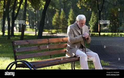 Lonely Upset Old Man Sitting Alone In Park And Thinking About Life