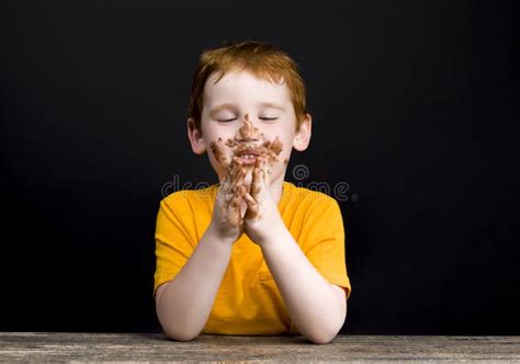 Red Haired Boy Smeared In Milk Chocolate Stock Photo Image Of Face