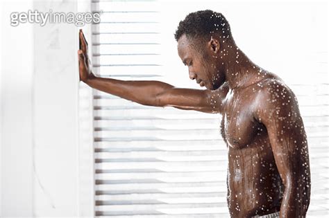 Naked Black Guy Taking Shower Washing Body In Modern Bathroom 이미지