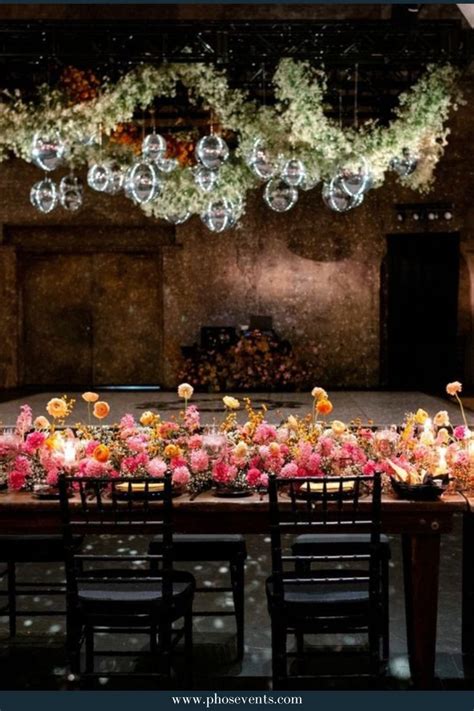 Disco Balls Hanging Instillationwith Greenery And Colorful Flower