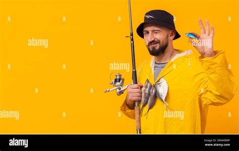 Fisherman Holding Fishing Rod With Bait Stock Photo Alamy