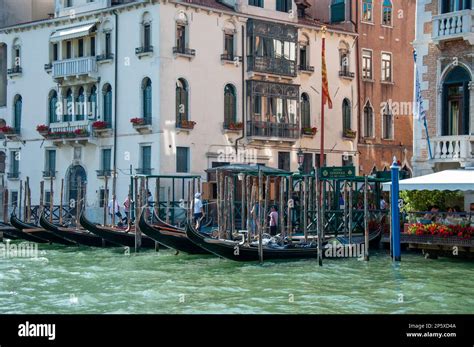 Gondolas And Boats Float On The Magnificent Grand Canal In Sunny Venice