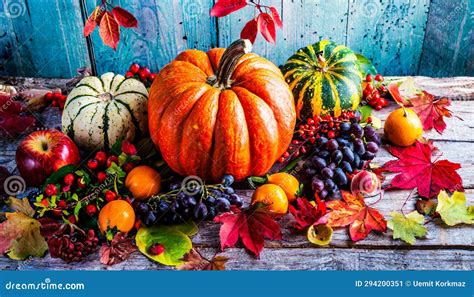 Autumn Thanksgiving Pumpkins Fruits And Falling Leaves On Rustic