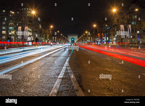 The Avenue Des Champs Élysées Leading Towards The Arc De Triomphe