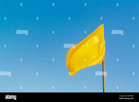 Yellow flag in the blue sky, mahabalipuram, tamil nadu/ India Stock ...