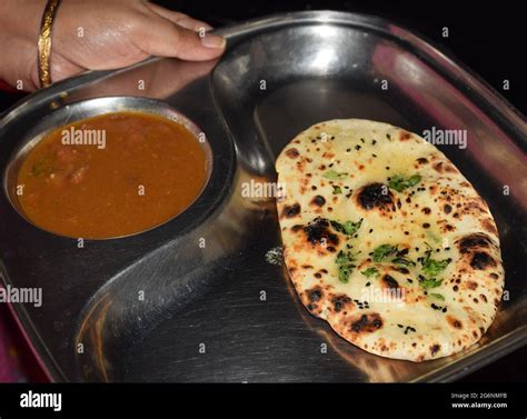 An Indian Butter Naan thali with Rajma is being served Stock Photo - Alamy