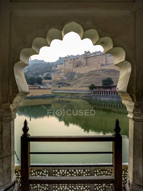 Maota Lake In Front Of Amer Fort Viewed Through A Scalloped Archway