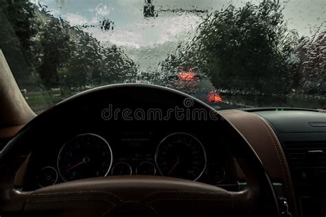 The Car Goes In The Rain View From The Inside Raindrops On The