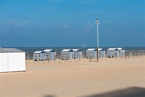 Beach Of The North Sea In Koksijde, Belgium Under Blue Sky Stock Image ...