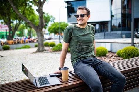 Handsome Young Man Dressed Casually Spending Time Outdoors At The City