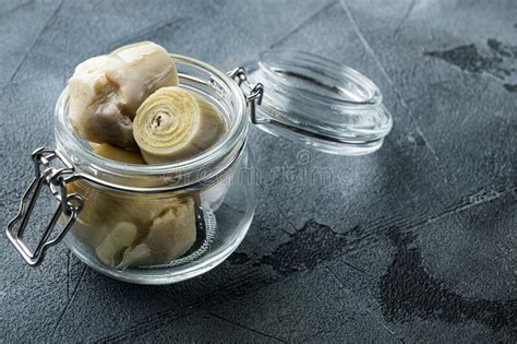 Artichoke Hearts Marinated In Olive Oil On Grey Background Stock Image