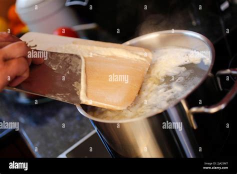 Swabian Cuisine Preparing Spaetzle For Cheese Spatulas Hand Scraped