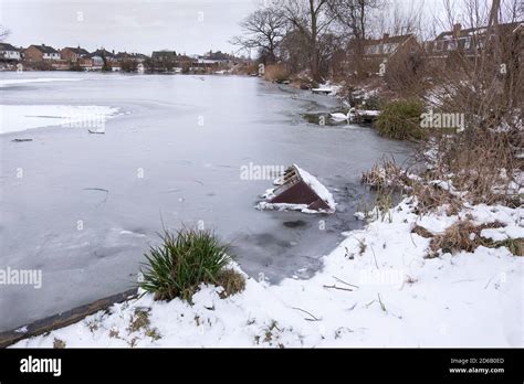 Frozen over fishing lake image Stock Photo - Alamy