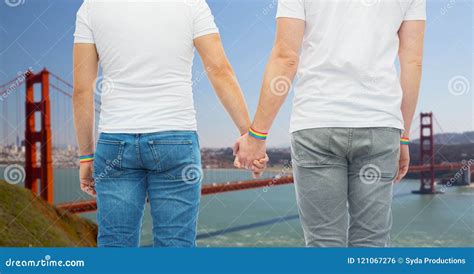 Male Couple With Gay Pride Rainbow Wristbands Stock Photo Image Of