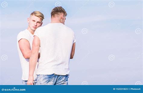 Friendship And Support Men Muscular Twins Brothers In White Shirts Sky