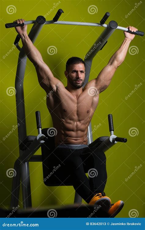 Healthy Man Performing Hanging Leg Raises Exercise Stock Image Image Of Male Bodybuilder