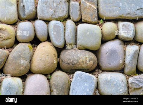 Pebble stone wall Stock Photo - Alamy