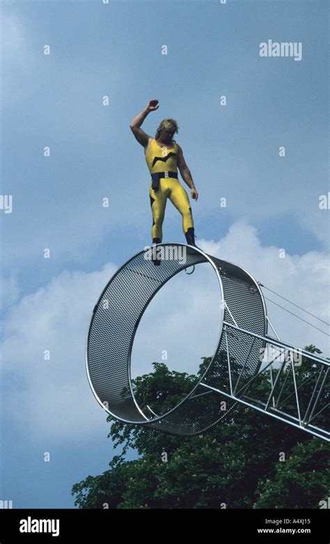 Circus Performer Balancing On Giant Wheel Stock Photo Alamy