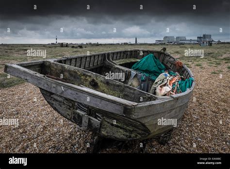 An Old Wooden Fishing Boat Abandoned On The Beach At Dungeness In Kent