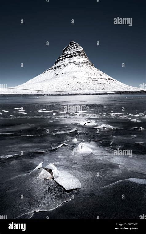 Kirkjufell mountain in winter with ice and snow Stock Photo - Alamy