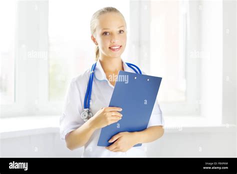 Female Doctor Holding A Notepad Stock Photo Alamy