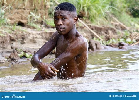 African Poor Man Taking A Bath In River Editorial Image | CartoonDealer ...