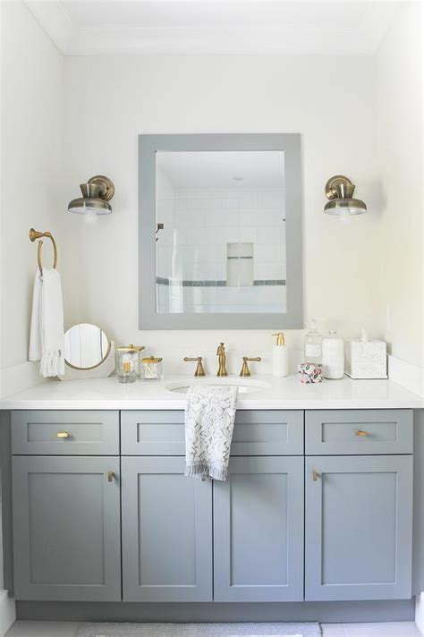 White Dual Bath Vanity With Shiny Gold Hardware And Mirror And Brass