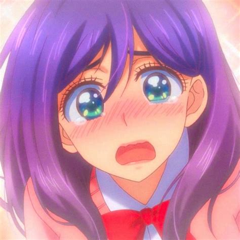 An Anime Girl With Blue Eyes And Purple Hair Wearing A Red Bow Tie