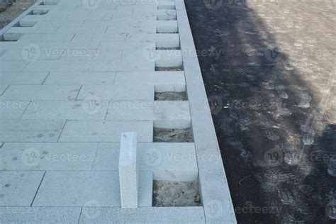 Laying Outdoor Bricks Concrete Grey Paving Slabs On The Street Urban