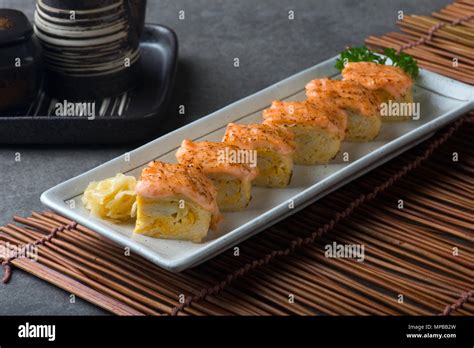 Aburi Salmon Engawa sushi roll Stock Photo - Alamy