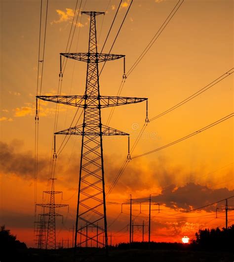 Silhouette High Voltage Electric Towers At Sunset Time High Voltage