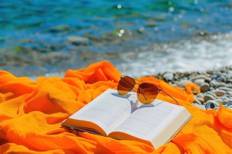 Premium Photo Book Sunglasses And Pareo On A Beach