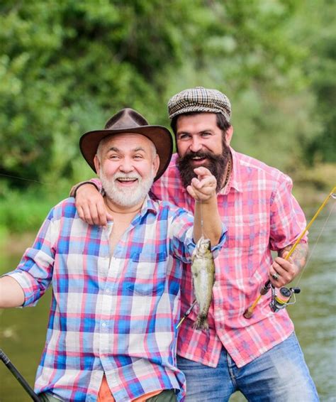 Premium Photo Father And Son Fishing Grandpa And Mature Man Friends