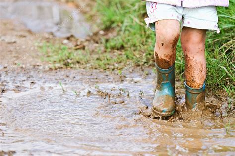 Playing in a mud puddle Stock Photo by ©StephanieFrey 2528335