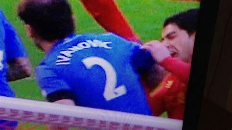 Liverpool's Luis Suarez BITES Chelsea defender Branislav Ivanovic ...