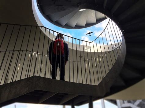 Premium Photo Low Angle View Of Man Standing On Steps In Building