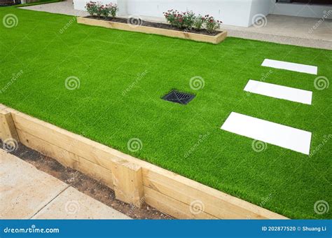 Artificial Grass Lawn Turf In The Front Yard Of A Modern Home