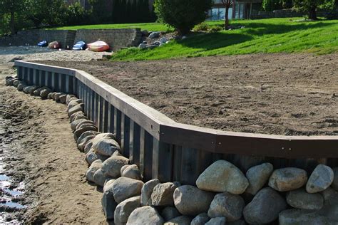 Contractor Building A Steel Seawall Bulkhead For Lake Property