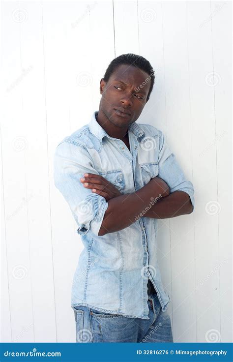 American Man Leaning Against Wall With Arms Crossed Stock Photo Image