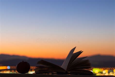 Book At Sunset With The Mountains In The Background Amazing Landscape