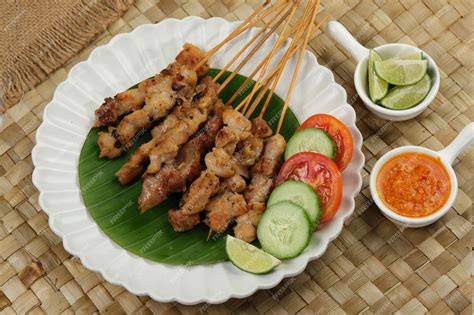 Premium Photo Sate Taichan Grilled Chicken Satay Served On Plate With