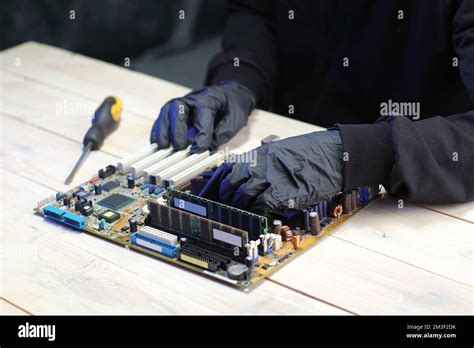 replacement of the chipset cooling system from the computer motherboard on the table Stock Photo ...