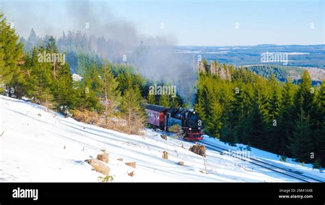 Steam train during winter in the snow in the Harz national park Germany ...