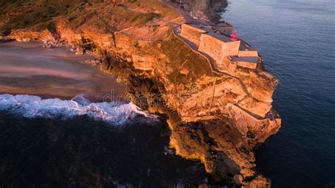 Aerial View of Ocean and Nazare Lighthouse at Sunset, Portugal Stock Photo - Image of dawn ...