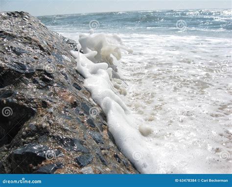 Wave Hitting Rock Stock Photo Image Of Foam Hits Beach 63478384