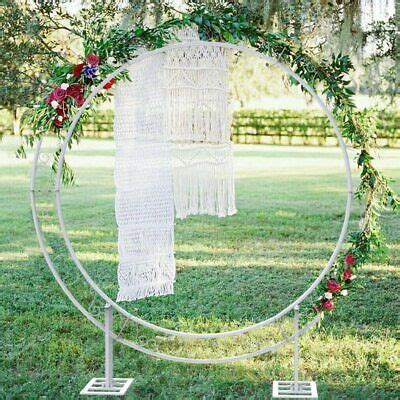 A Wedding Ceremony Decoration With Flowers And Greenery Is Displayed In