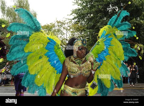 Women Wearing Traditional Caribbean Carnival Costume At Notting Hill