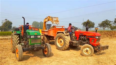 New Jcb 3dx Eco Backhoe Machine Loading Red Mud In Mahindra And Eicher